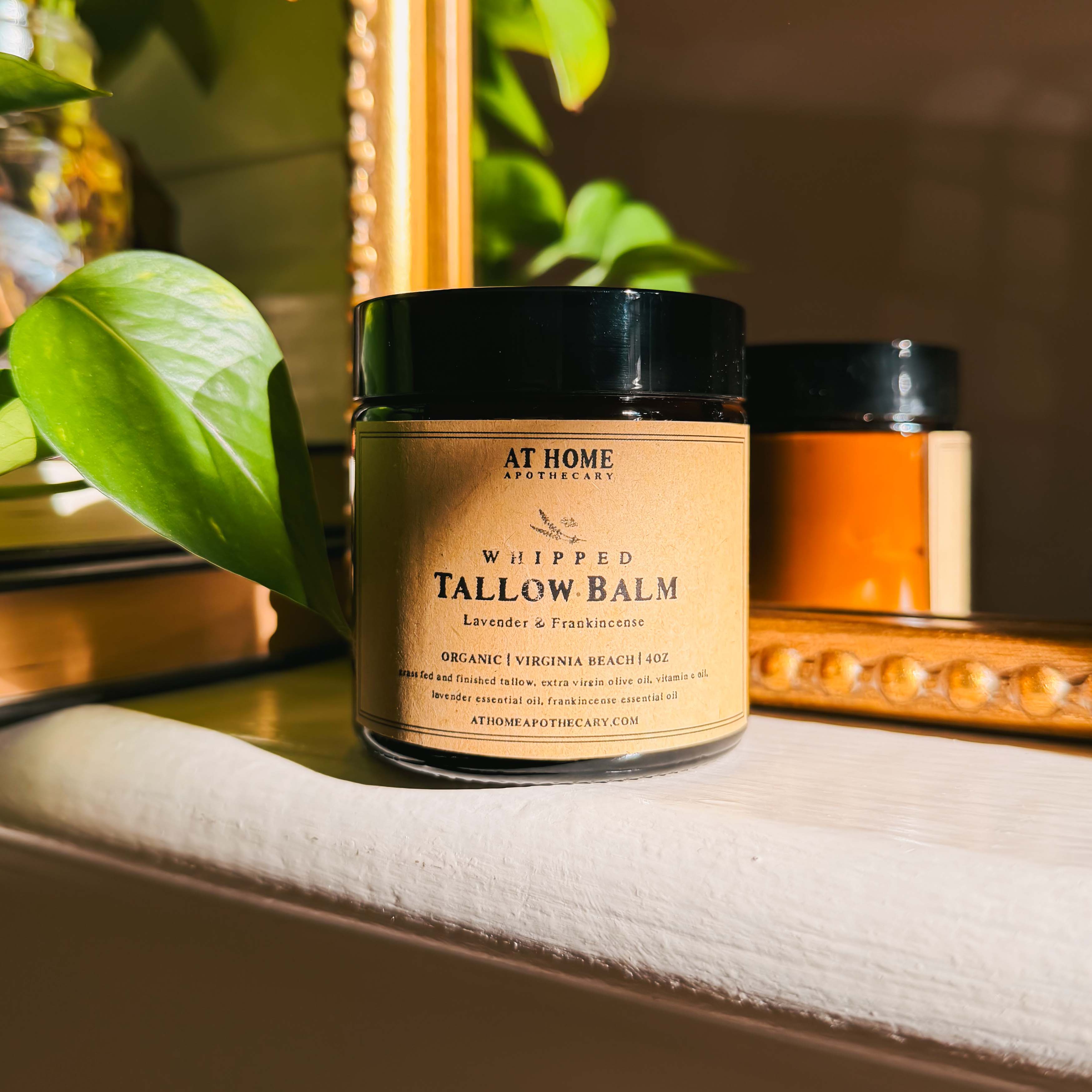 At Home Apothecary Whipped Tallow Balm jar on a mantle