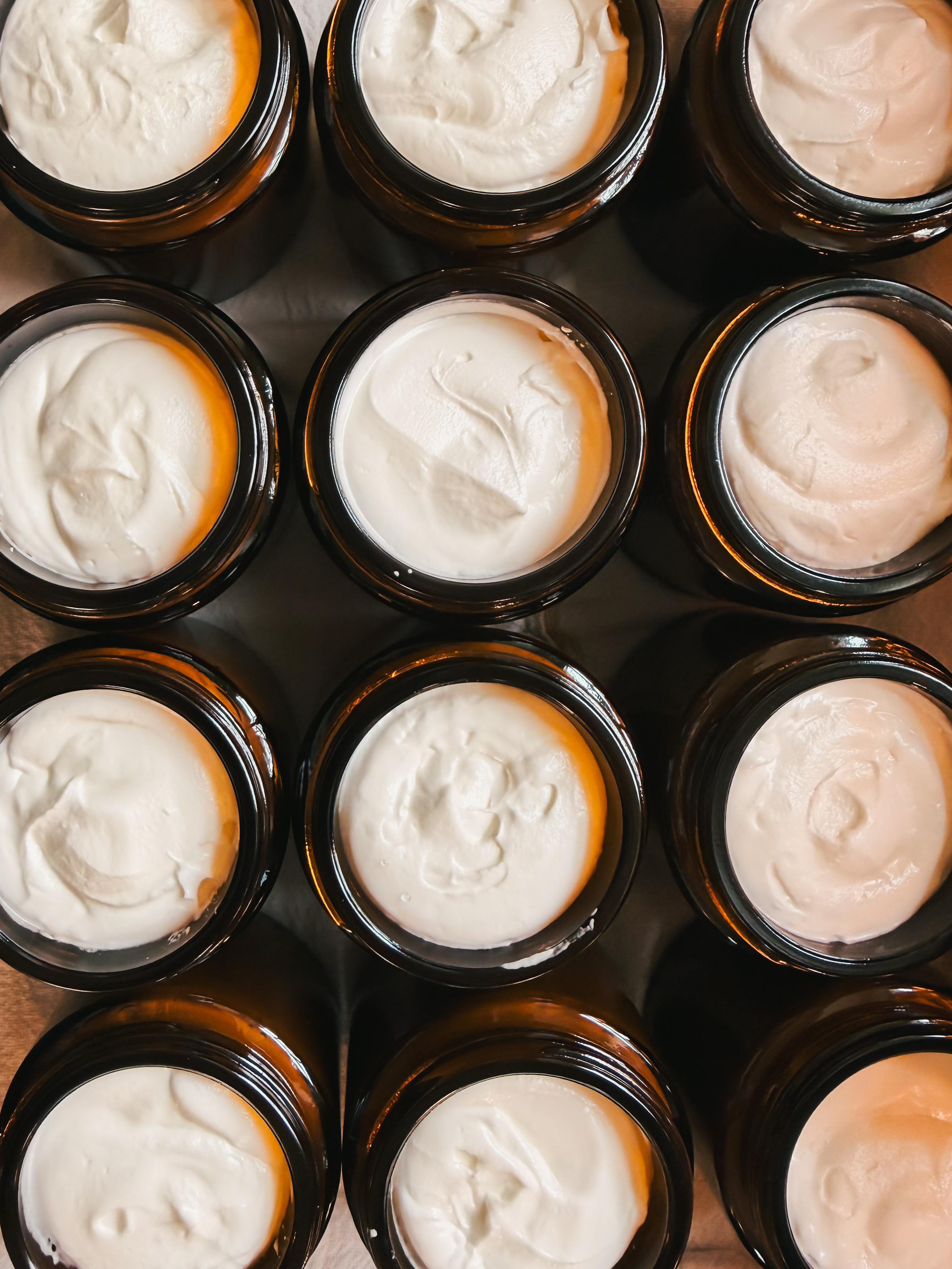 At Home Apothecary Whipped Tallow Balm jar on a mantle